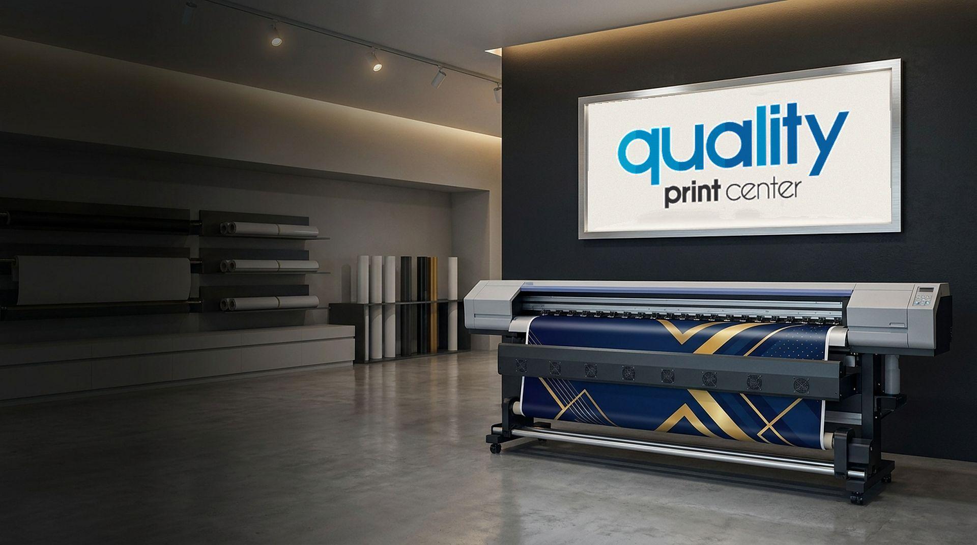 The Quality Print Center sign above a wide-format printer printing a navy and gold banner
